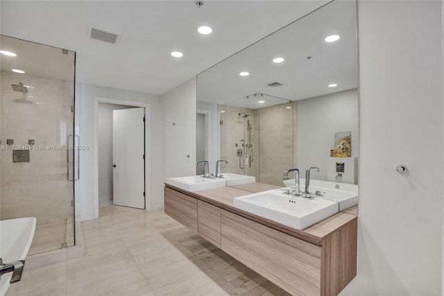 bathroom featuring vanity and separate shower and tub