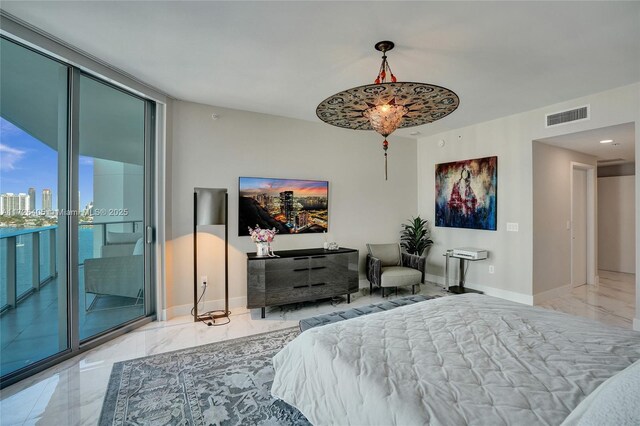 bedroom featuring access to exterior and floor to ceiling windows