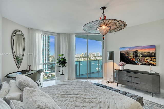 bedroom featuring floor to ceiling windows and access to outside