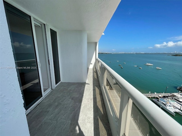 balcony featuring a water view