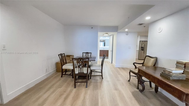 dining area with recessed lighting, light wood-type flooring, visible vents, and baseboards