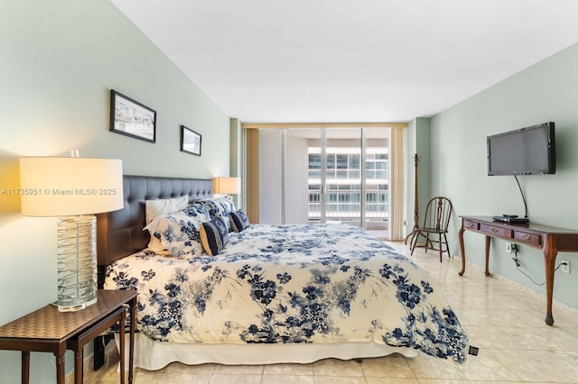 bedroom with floor to ceiling windows