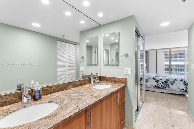 bathroom featuring tile patterned flooring and vanity