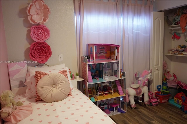 bedroom with wood-type flooring