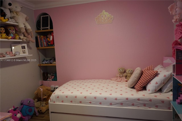 bedroom with ornamental molding