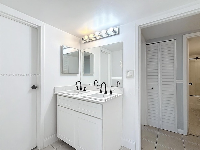 bathroom with vanity and tile patterned flooring