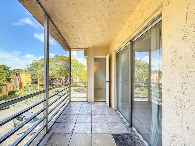 unfurnished sunroom featuring a wealth of natural light