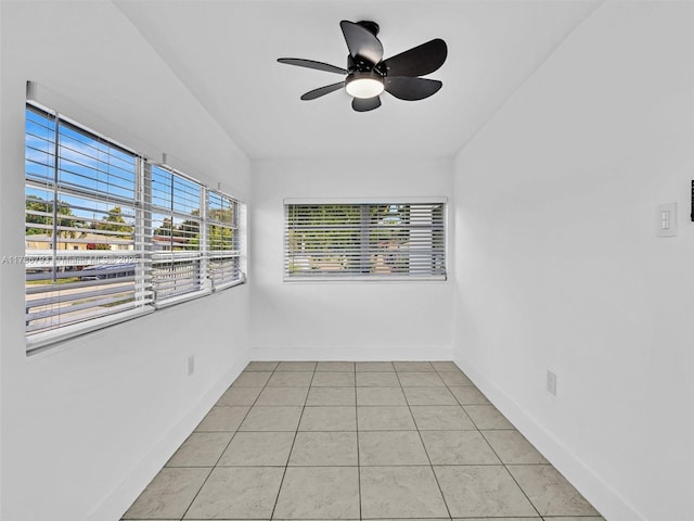 774 W 31st St, Hialeah, FL 33012 - spare room with light tile patterned floors, baseboards, ceiling fan, and lofted ceiling