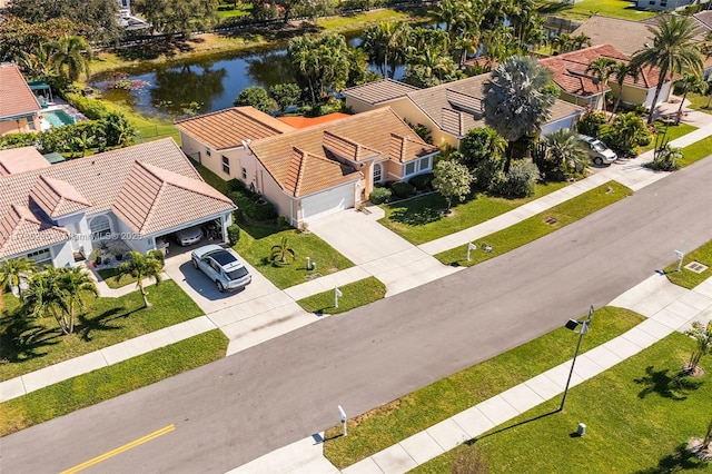 birds eye view of property featuring a water view