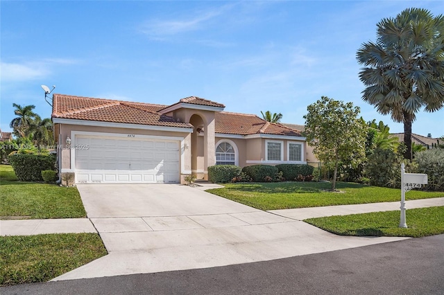 mediterranean / spanish-style house with a garage and a front lawn