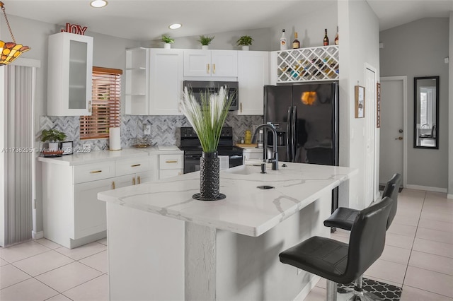 kitchen with open shelves, glass insert cabinets, white cabinets, a sink, and black appliances