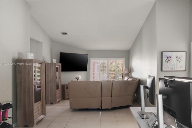 living area featuring visible vents and light tile patterned floors