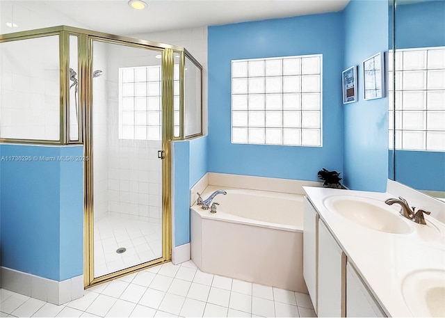 bathroom with double vanity, a sink, a bath, and a shower stall