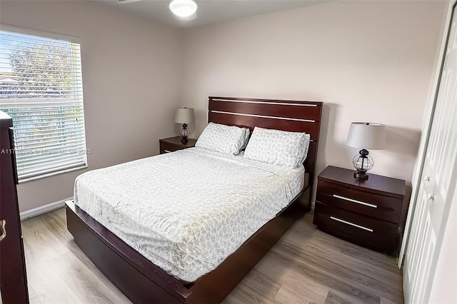 bedroom with wood finished floors