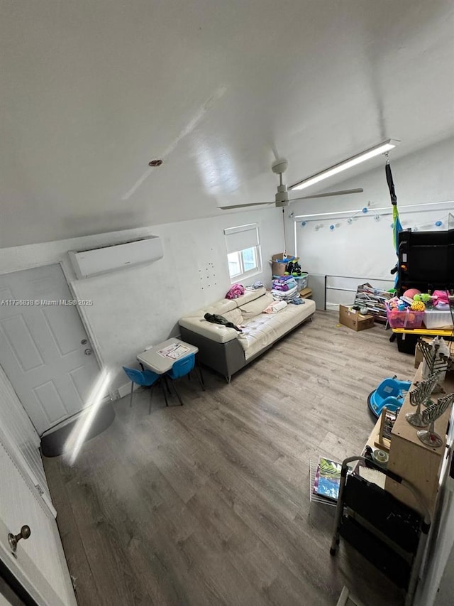 interior space with wood-type flooring and an AC wall unit