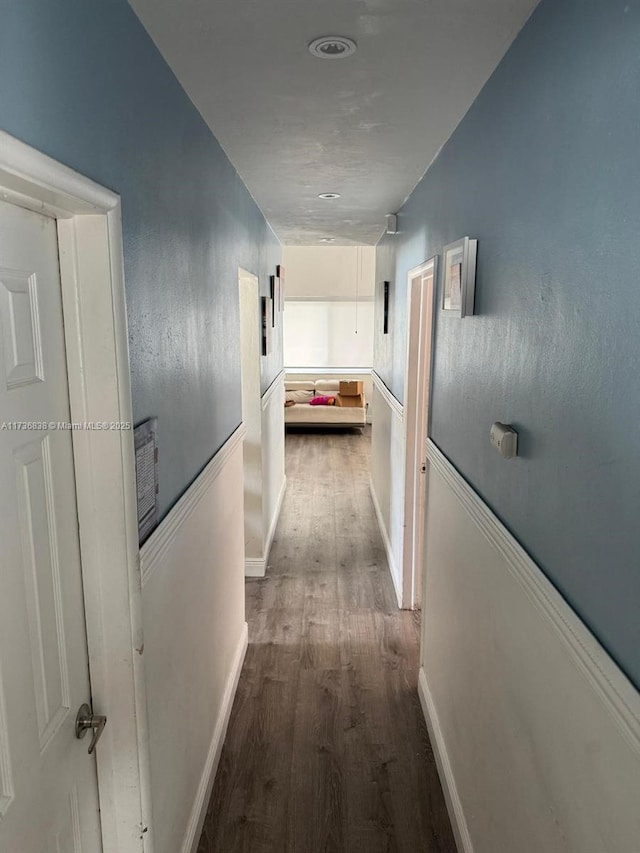 corridor featuring dark hardwood / wood-style floors