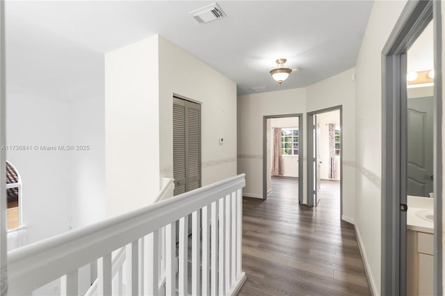 hallway with dark hardwood / wood-style floors