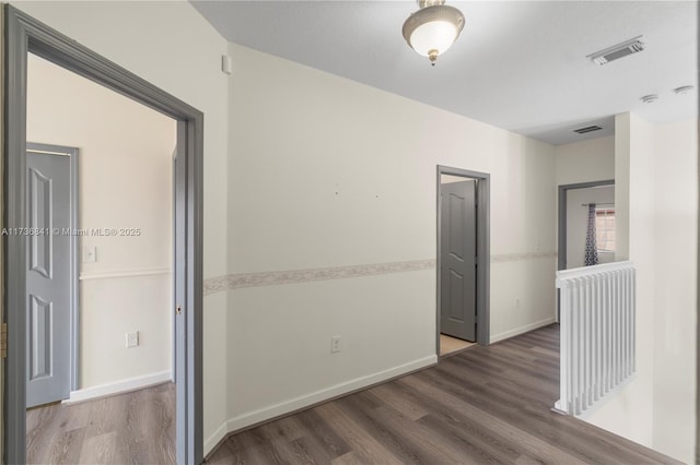 hall featuring dark wood-type flooring