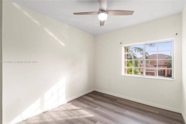 unfurnished room featuring light hardwood / wood-style floors and ceiling fan