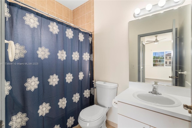 bathroom with vanity, toilet, and curtained shower