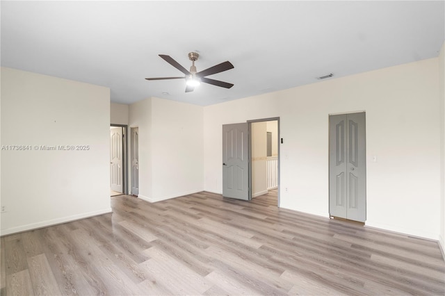 empty room featuring light hardwood / wood-style flooring and ceiling fan