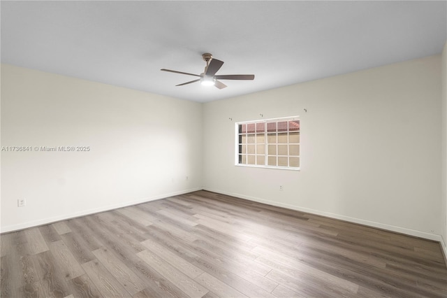 empty room featuring light hardwood / wood-style flooring and ceiling fan