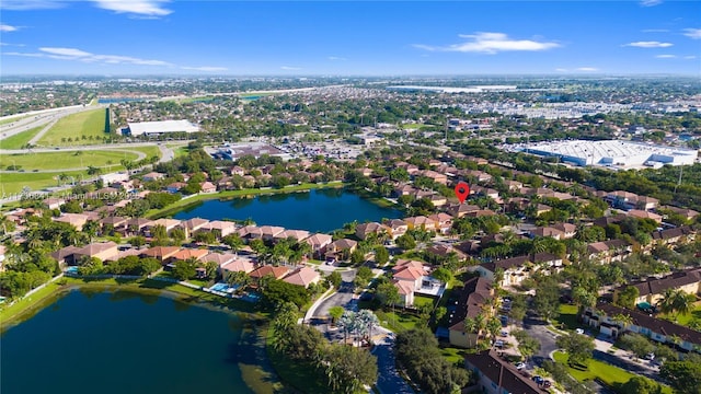 drone / aerial view with a water view