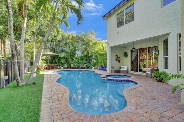 view of pool featuring an in ground hot tub and a patio area