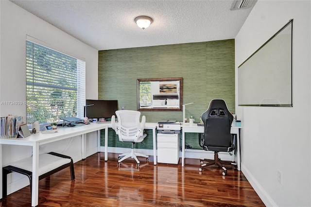 office space featuring dark wood-type flooring and a textured ceiling