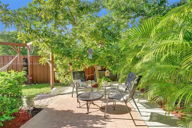 view of patio with a fire pit