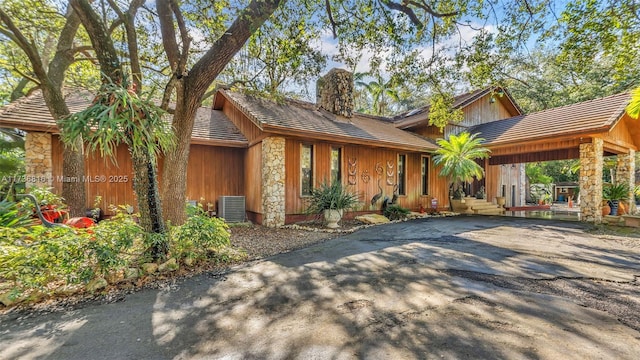 single story home with central air condition unit