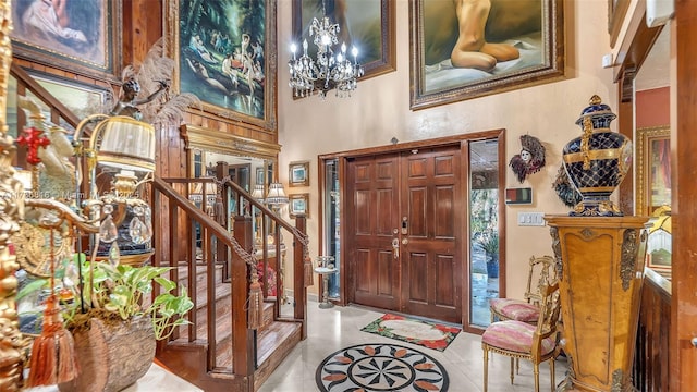 entrance foyer with an inviting chandelier and light tile patterned floors