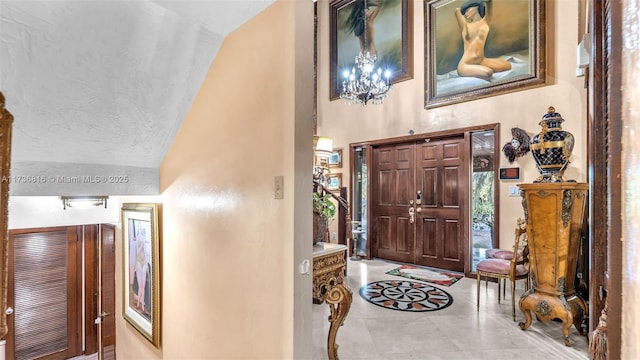 foyer featuring high vaulted ceiling