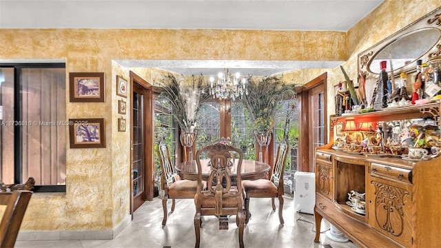 dining space with a notable chandelier