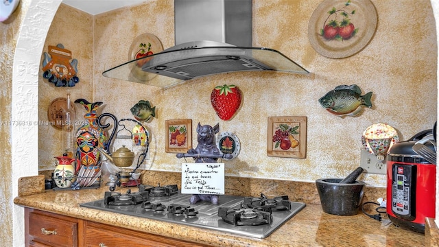 kitchen featuring range hood and stainless steel gas cooktop