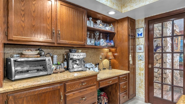 bar with backsplash and light stone counters