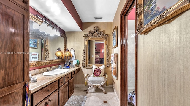 bathroom with tile patterned floors and vanity