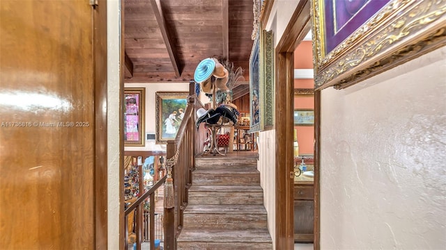 interior space featuring beamed ceiling, wood ceiling, and hardwood / wood-style floors