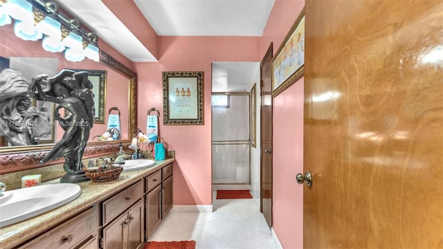 bathroom with vanity, tile patterned floors, and a shower with door