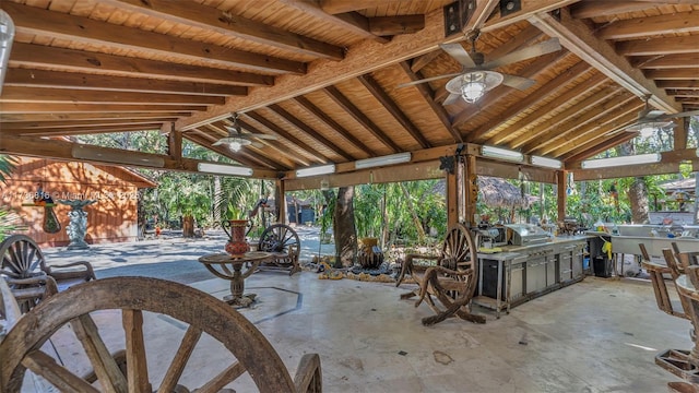 view of patio with area for grilling, a grill, a gazebo, and ceiling fan