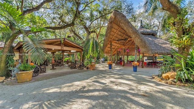 view of property's community with a gazebo and a patio