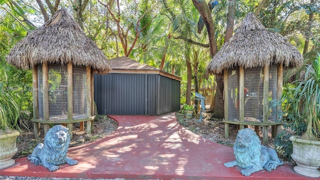 view of patio / terrace with an outdoor structure