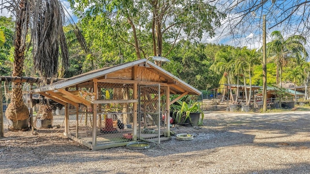 view of home's community with an outdoor structure