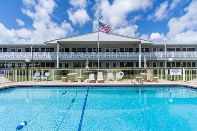 community pool featuring fence