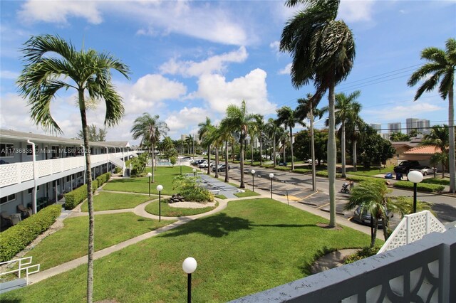 view of home's community featuring a lawn