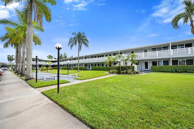 view of community featuring a lawn