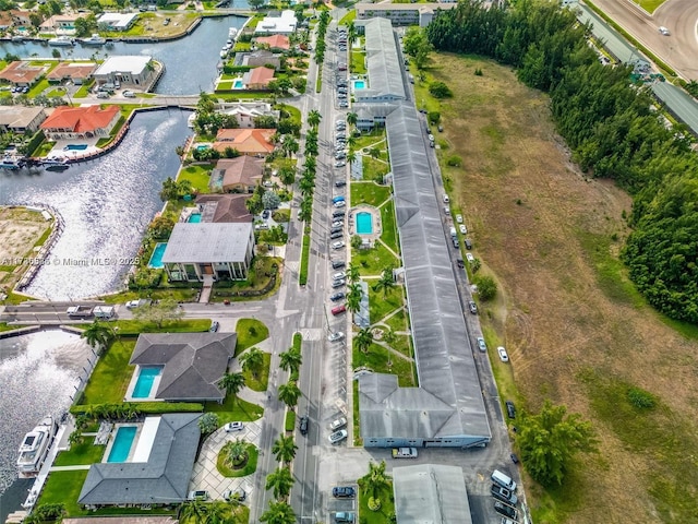 birds eye view of property featuring a residential view and a water view