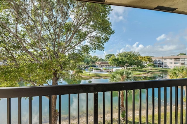 balcony featuring a water view