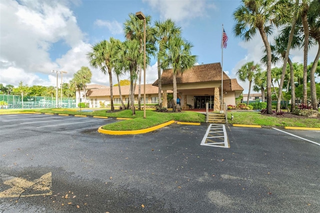 view of building exterior featuring uncovered parking