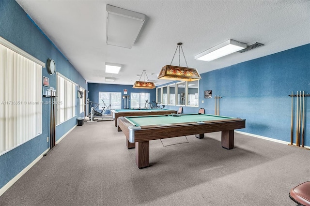 rec room featuring baseboards, visible vents, a textured ceiling, and carpet flooring